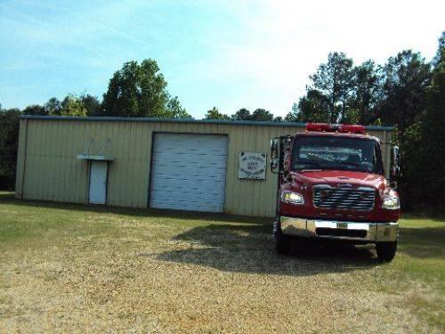 Firetruck from front with fire station behind